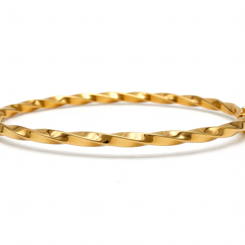 Petrals spirál tekercs karperec sárga aranyból csavarodó szalaglánccal.