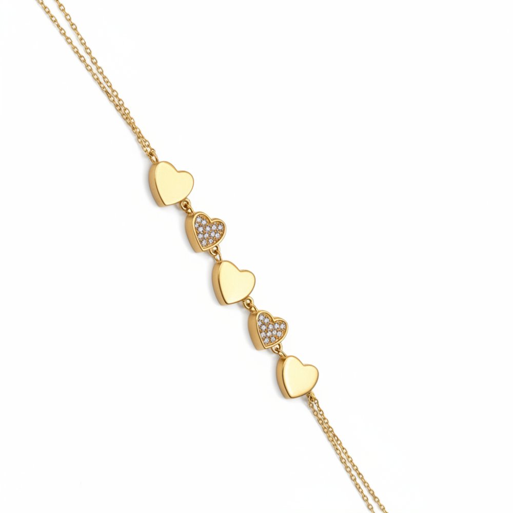 Petrals 14 karátos sárga arany karkötő váltakozó mikropavé cirkónia köves és selyemfényű polírozott szív motívumokkal.
