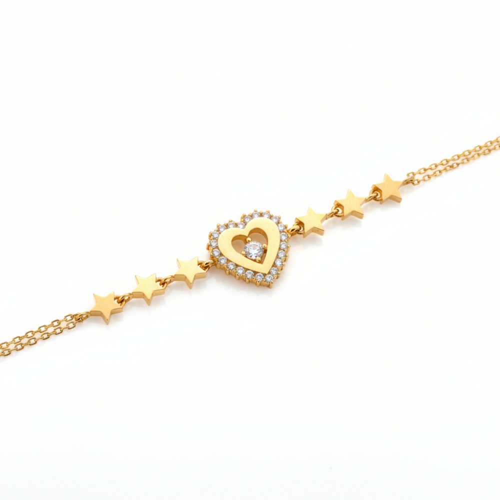 Petrals 14 karátos sárga arany karkötő cirkónia köves szív medállal és apró, selyemfényű polírozott csillag díszekkel.
