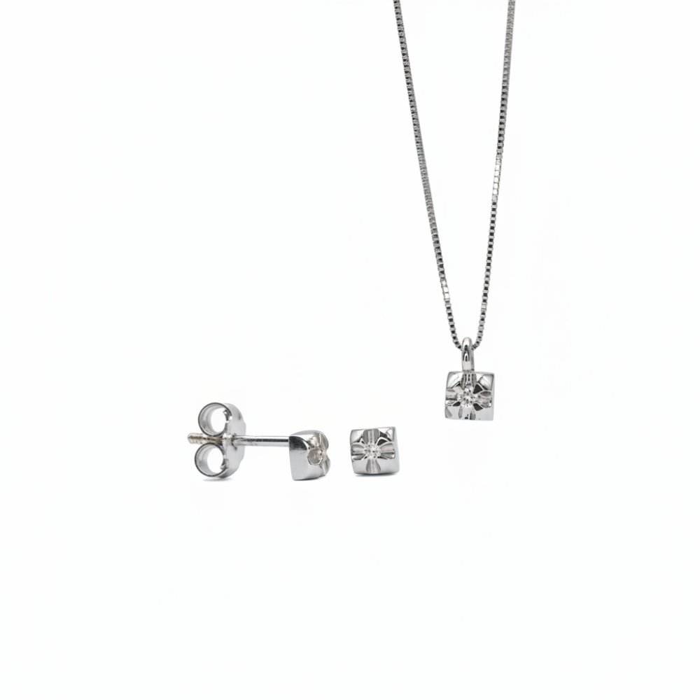 Petrals 14 karátos fehér arany ékszerszett sugaras napsugár motívummal, karmos foglalatú szikrázó kövekkel és ródium bevonattal.